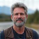 Portrait of David Lim, an older, experienced biker with a rugged look.